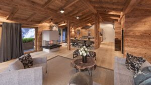 Chalet Design Wohnzimmer in Altholz mit Holz Tisch und Kamin